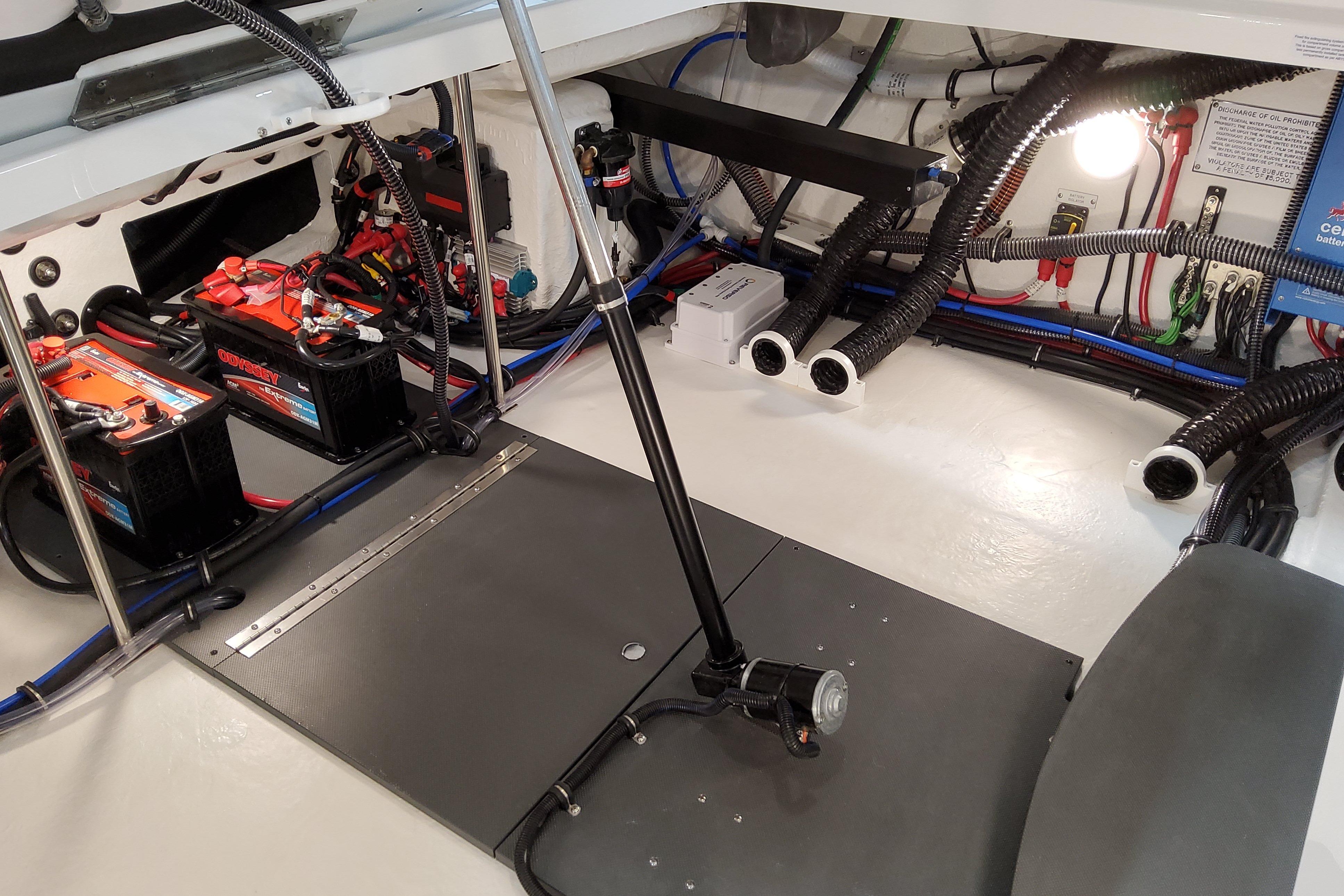 Slide: The Image of Engine compartment of 2026 Formula 310 Bowrider OB with batteries and wiring. - 12