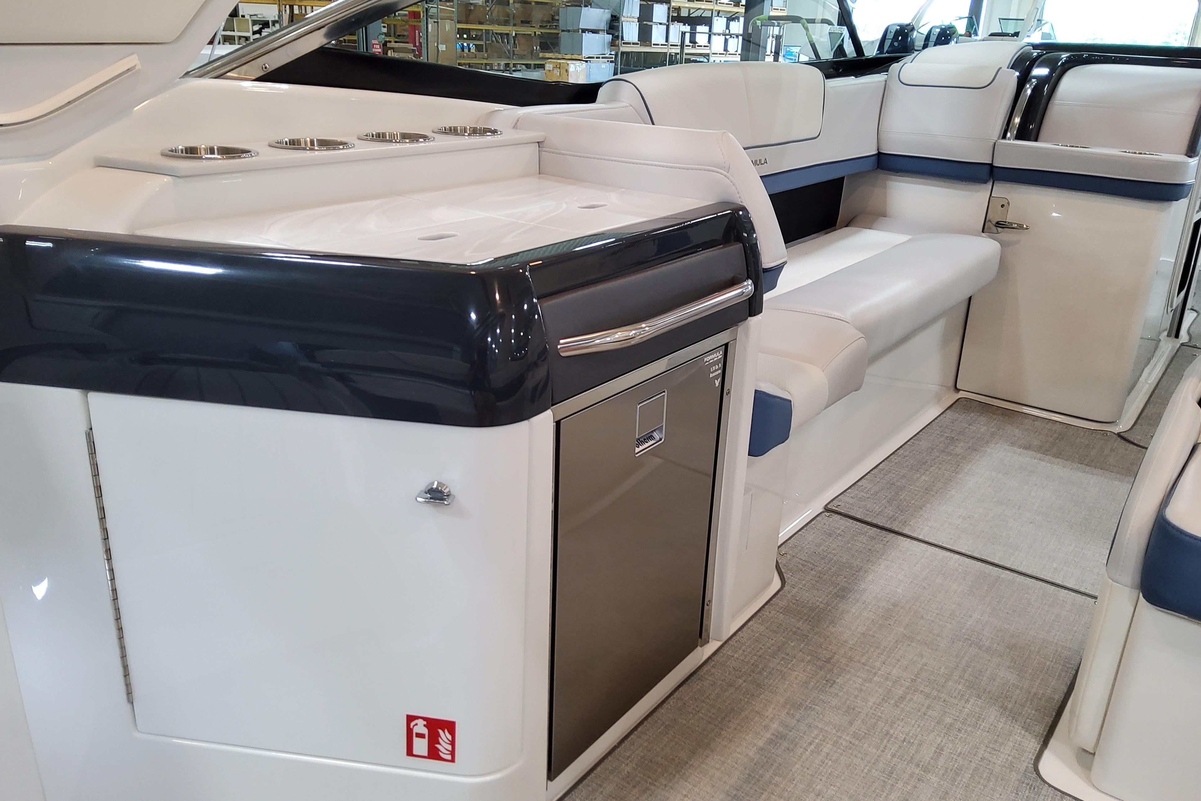 Slide: The Image of 2026 Formula 310 Bowrider OB interior with seating and built-in amenities. - 15