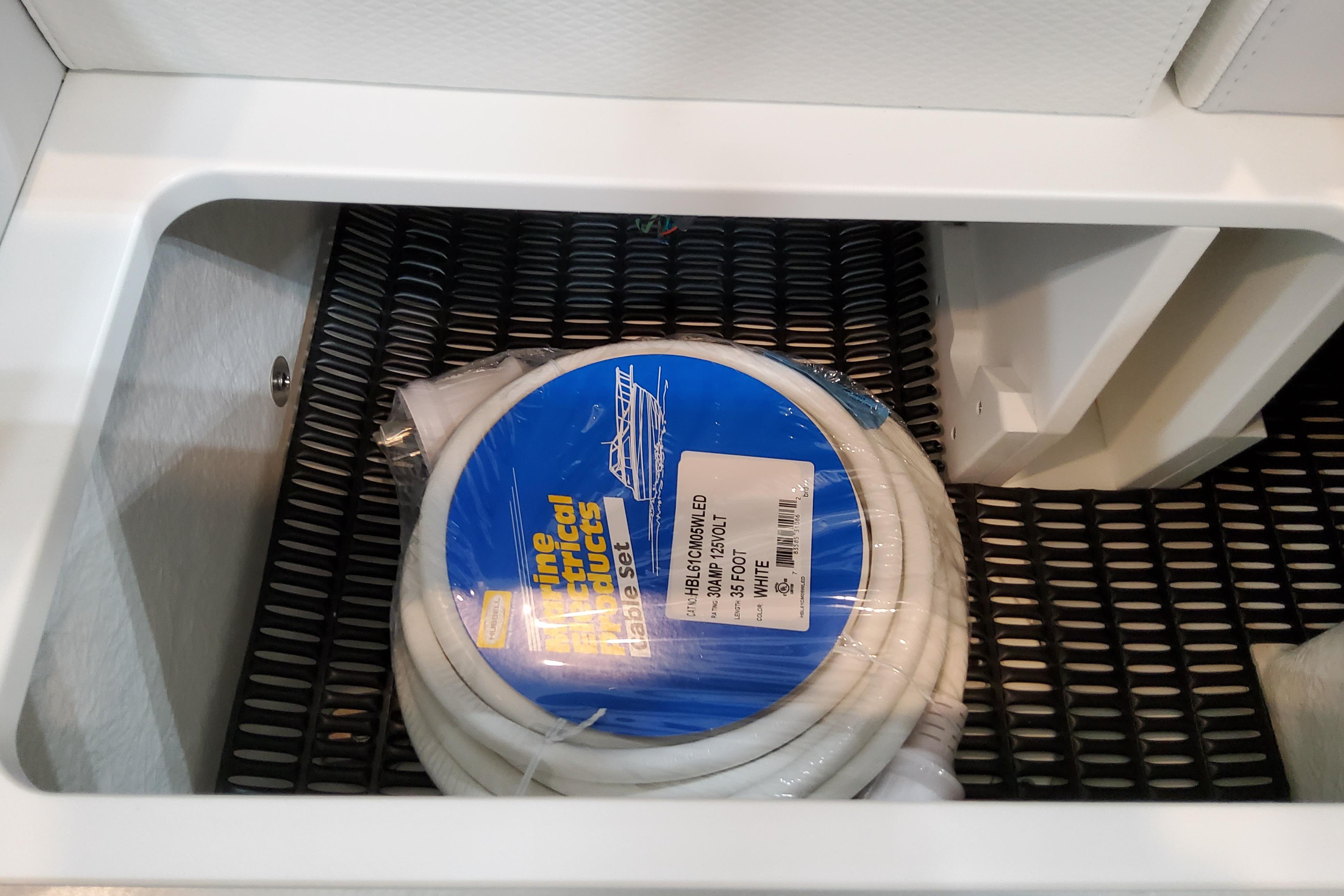 Slide: The Image of Storage compartment in 2026 Formula 310 Bowrider OB with marine electrical cable set. - 24