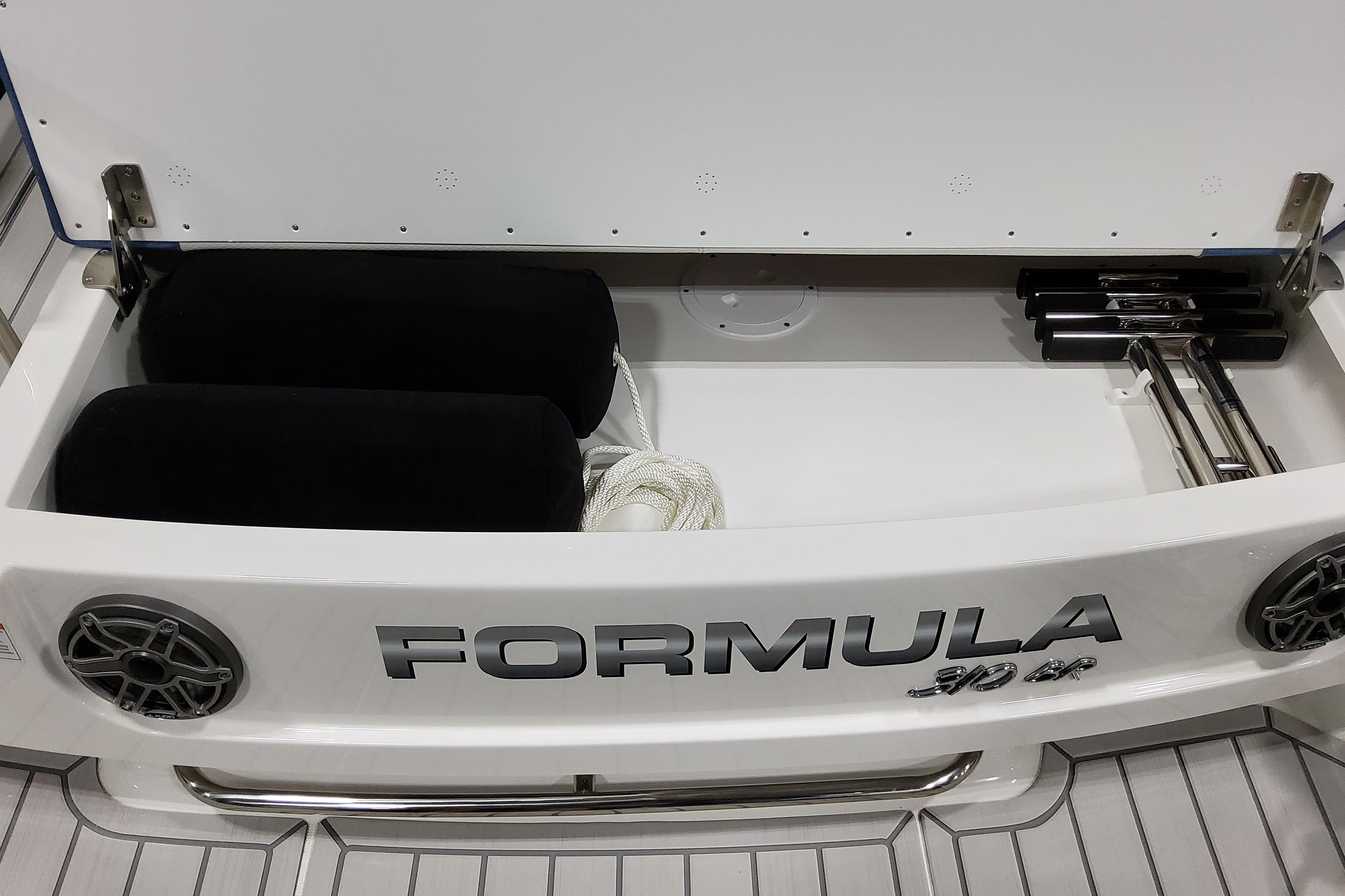 Slide: The Image of 2026 Formula 310 Bowrider OB storage compartment with speakers and accessories. - 27