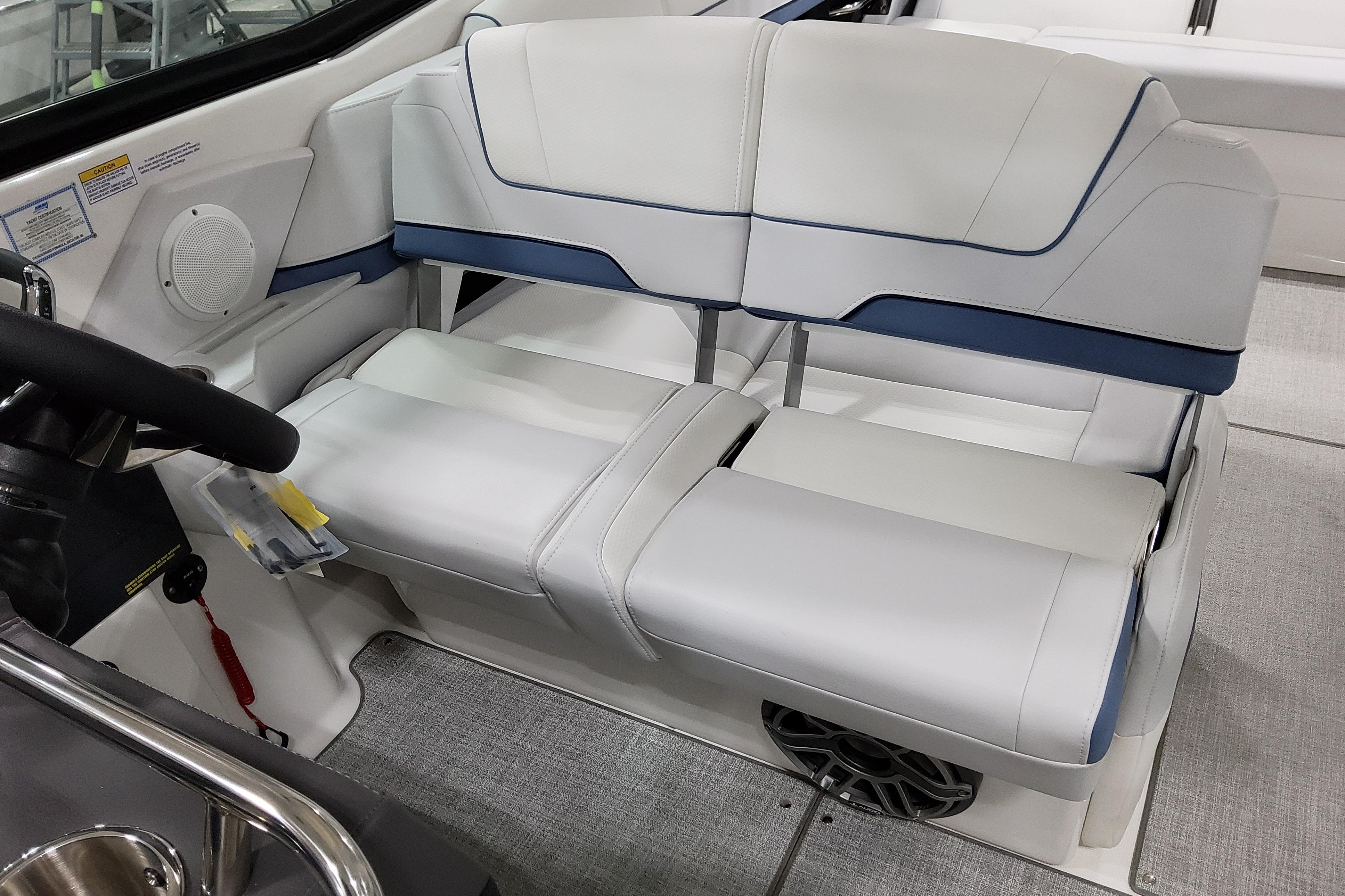 Slide: The Image of 2026 Formula 310 Bowrider OB interior seating with white and blue upholstery. - 28