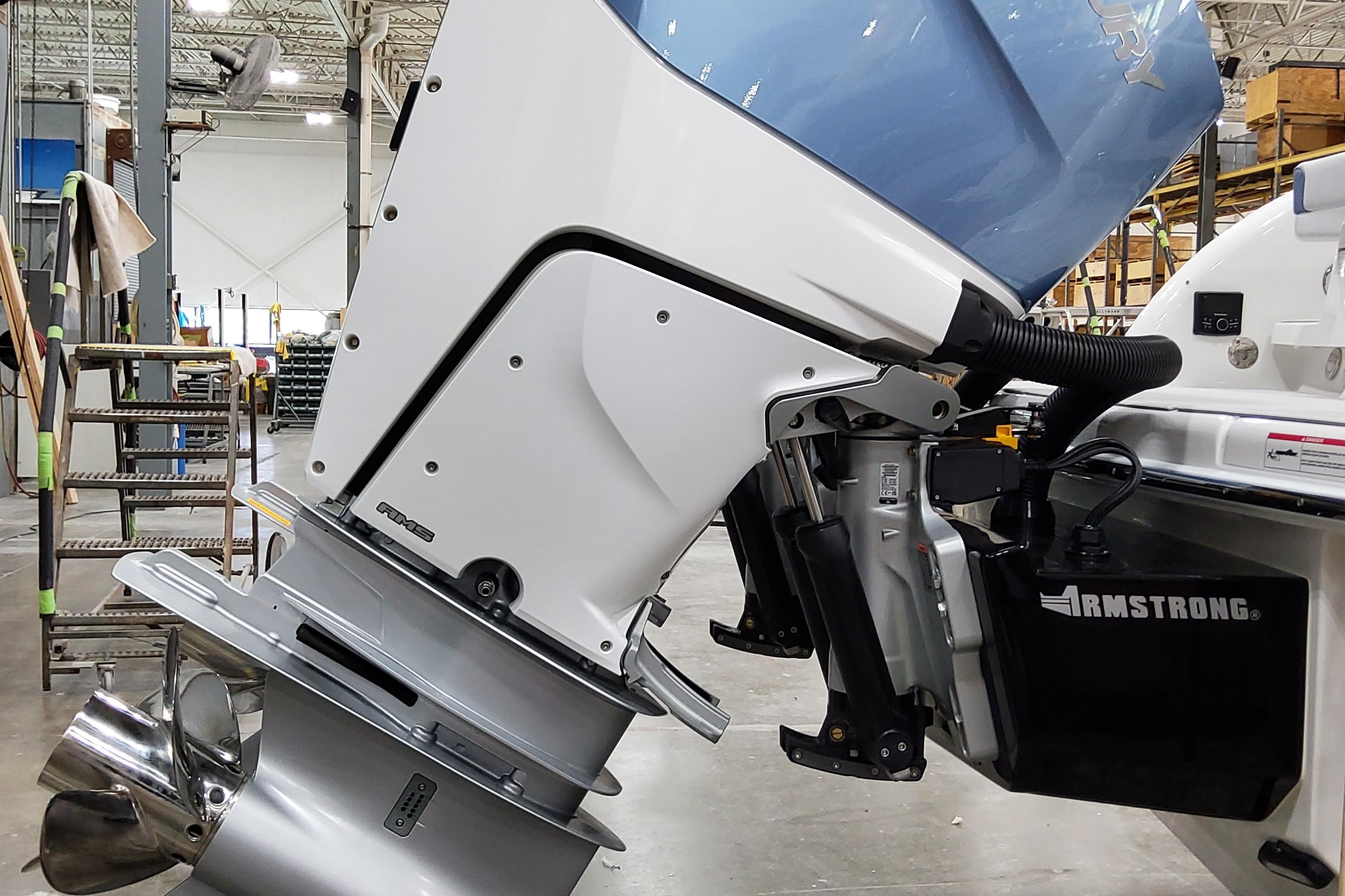Slide: The Image of 2026 Formula 310 Bowrider OB outboard motor in a workshop setting. - 6