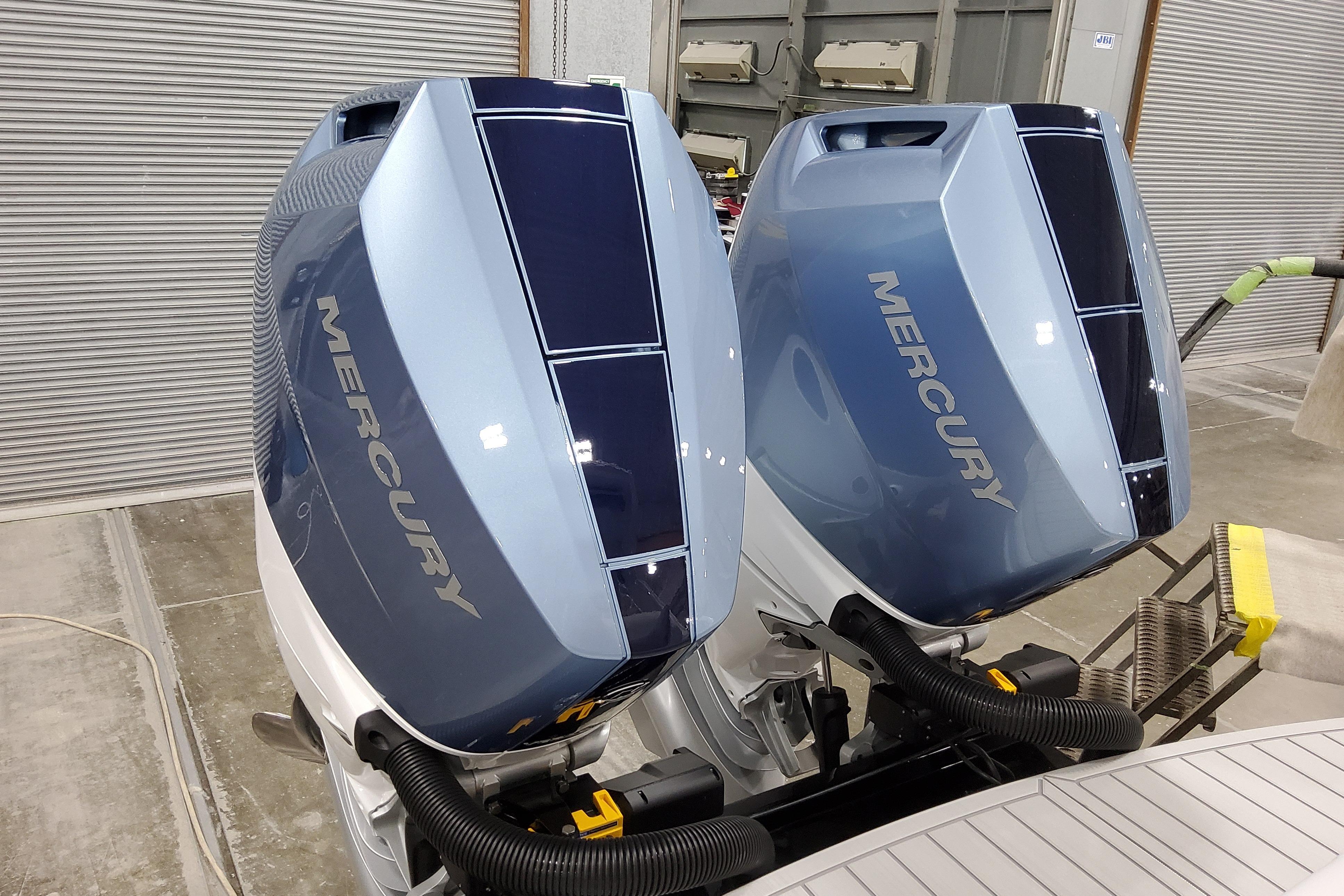 Slide: The Image of Twin Mercury outboard engines on a 2026 Formula 310 Bowrider OB boat. - 9
