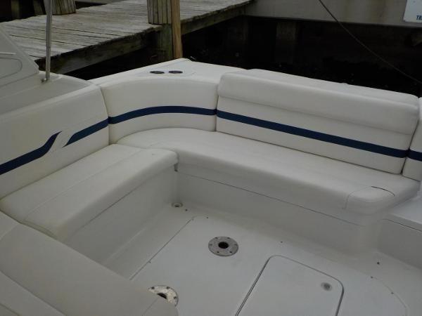 Slide: The Image of 2006 Formula 330 SS boat interior with white seating and blue accents. - 10
