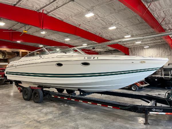 Slide: The Image of 1999 Formula 330 SS Sun Sport boat on trailer in indoor storage facility. - 1