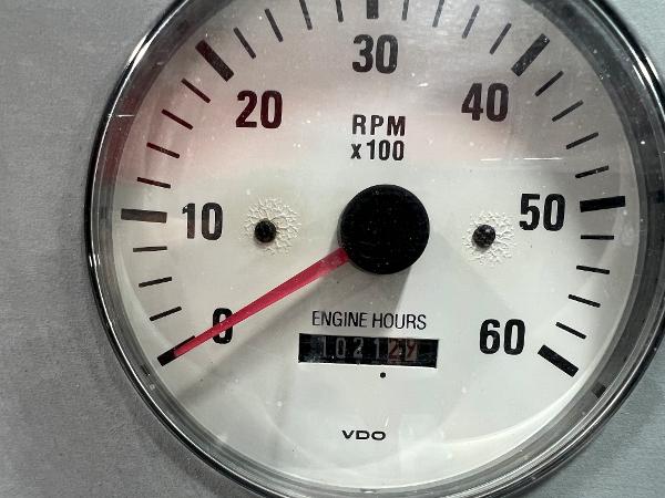 Slide: The Image of 1999 Formula 330 SS Sun Sport tachometer showing 1021.2 engine hours. - 12