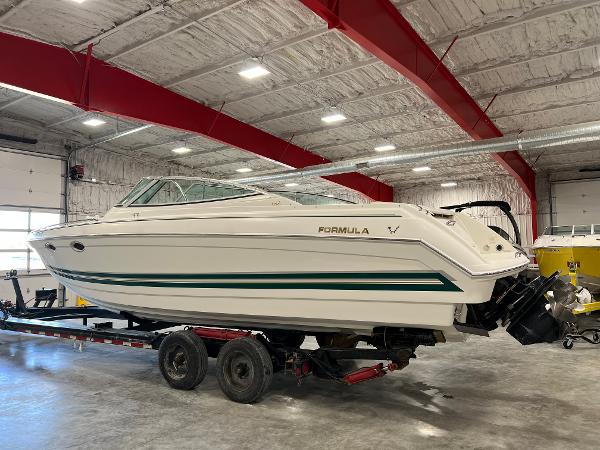 Slide: The Image of 1999 Formula 330 SS Sun Sport boat on trailer in indoor storage facility. - 3