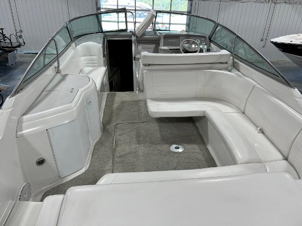 Slide: The Image of 1999 Formula 330 SS Sun Sport boat interior with white seating and helm. - 5