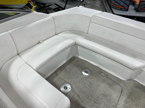 Slide: The Image of 1999 Formula 330 SS Sun Sport boat interior with white leather seating and carpeted floor. - 7