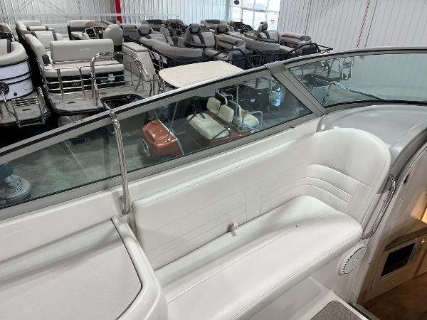 Slide: The Image of 1999 Formula 330 SS Sun Sport boat interior with white seating in showroom. - 8