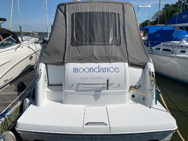 Slide: The Image of 2005 Formula 34 PC boat named Moondance docked at a marina. - 31