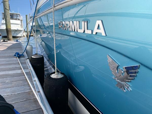 Slide: The Image of 2005 Formula 34 PC boat docked at marina, side view. - 36