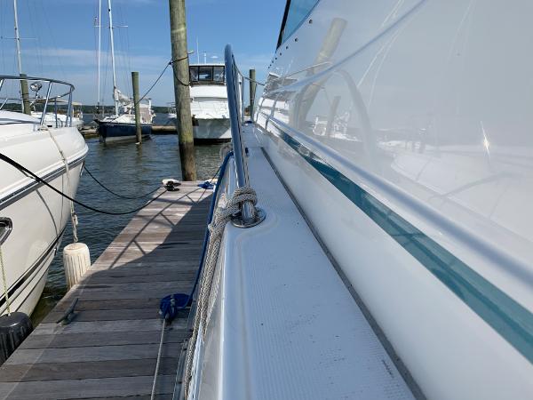 Slide: The Image of 2005 Formula 34 PC yacht docked at a marina on a sunny day. - 37