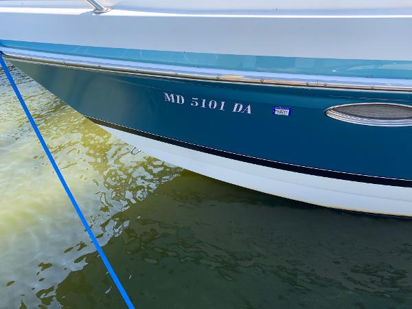 Slide: The Image of 2005 Formula 34 PC boat with registration number MD 5101 DA docked in water. - 38
