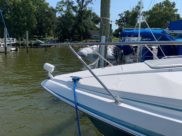 Slide: The Image of 2005 Formula 34 PC boat docked at a marina on a sunny day. - 41