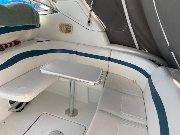 Slide: The Image of 2005 Formula 34 PC boat interior with white and blue seating and table. - 43