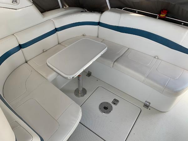 Slide: The Image of 2005 Formula 34 PC boat interior with white and blue seating and table. - 47