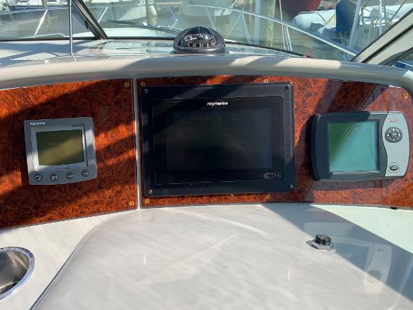 Slide: The Image of Dashboard of a 2005 Formula 34 PC boat with navigation and control systems. - 48