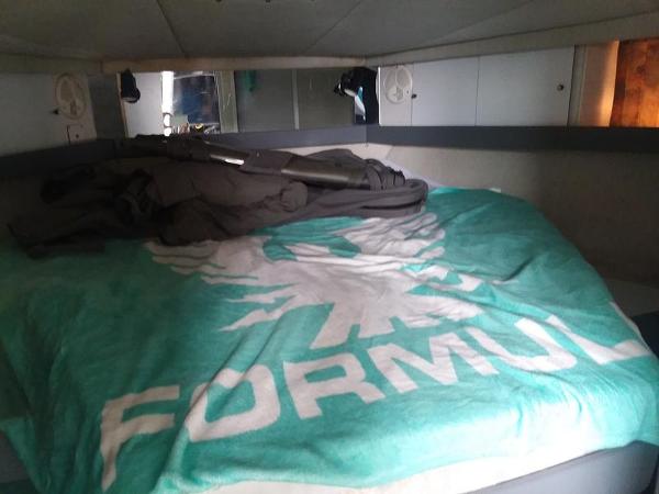 Slide: The Image of 1990 Formula 36 PC cabin interior with branded bedding. - 19