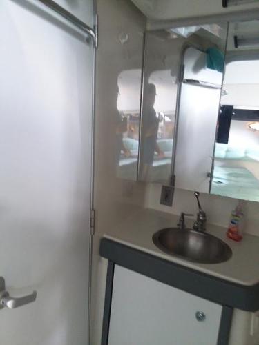 Slide: The Image of 1990 Formula 36 PC bathroom with sink and mirror. - 20