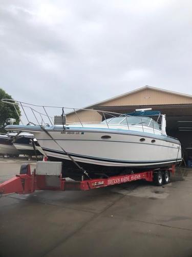 Slide: The Image of 1990 Formula 36 PC boat on a trailer outside a storage facility. - 22