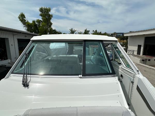 Slide: The Image of 2021 Formula 380 SSC boat front view with windshield and wipers. - 11