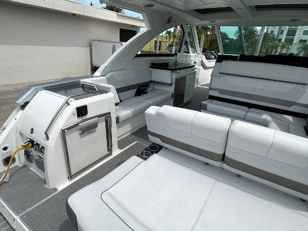 Slide: The Image of 2021 Formula 380 SSC boat interior with white seating and modern amenities. - 13