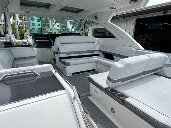 Slide: The Image of 2021 Formula 380 SSC luxury boat interior with white seating and modern design. - 14