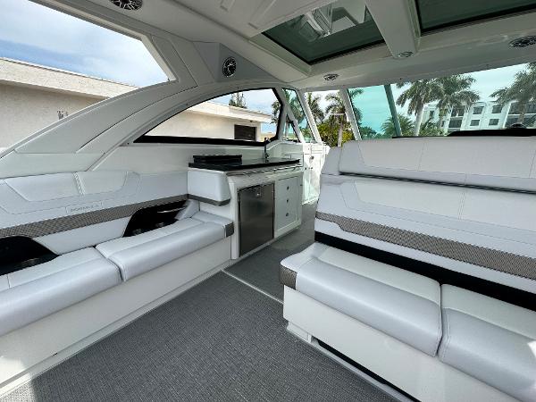 Slide: The Image of 2021 Formula 380 SSC boat interior with white seating and kitchenette. - 15