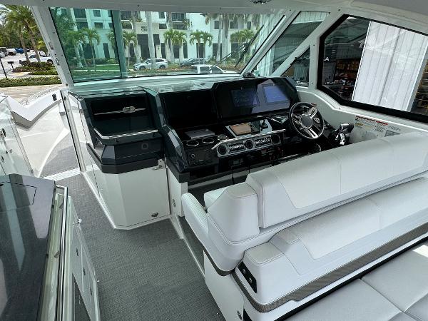 Slide: The Image of 2021 Formula 380 SSC boat cockpit with modern navigation system and white seating. - 16