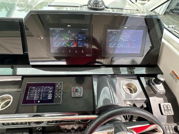 Slide: The Image of 2021 Formula 380 SSC dashboard with dual touchscreen displays and controls. - 17
