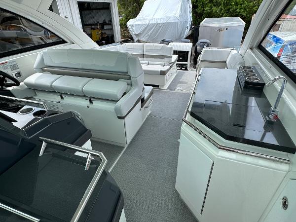 Slide: The Image of 2021 Formula 380 SSC boat interior with seating and kitchenette. - 18