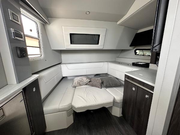 Slide: The Image of Interior cabin of a 2021 Formula 380 SSC boat with modern seating and cabinetry. - 25