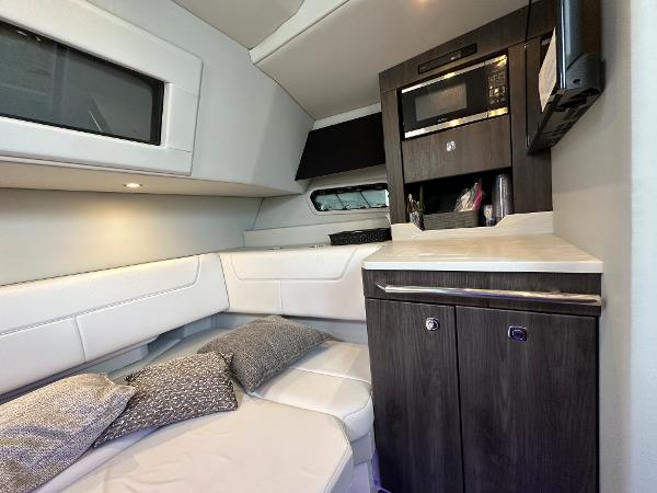 Slide: The Image of 2021 Formula 380 SSC cabin interior with modern kitchenette and cozy seating area. - 26