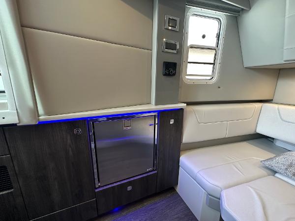 Slide: The Image of Interior of 2021 Formula 380 SSC yacht with modern seating and mini fridge. - 27