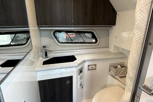 Slide: The Image of 2021 Formula 380 SSC boat interior with modern kitchenette and window. - 28