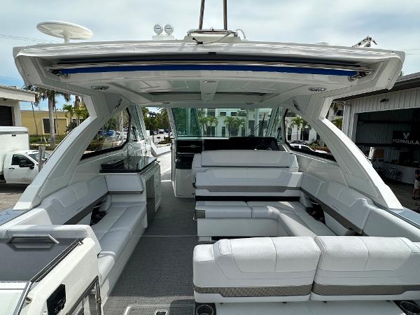 Slide: The Image of 2021 Formula 380 SSC luxury yacht interior with white seating and modern amenities. - 6