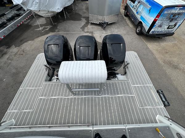 Slide: The Image of 2021 Formula 380 SSC boat with triple outboard engines, rear deck view. - 8