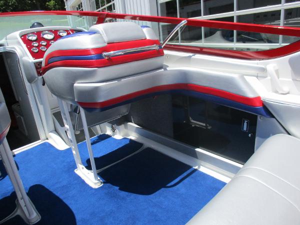 Slide: The Image of 1997 Formula 382 FASTech boat interior with blue carpet and red accents. - 14