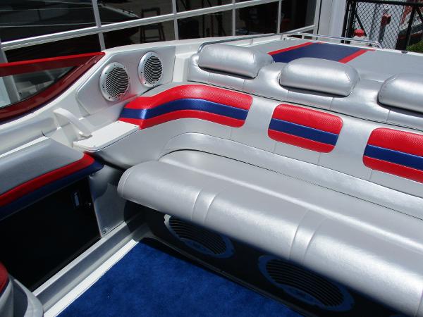 Slide: The Image of 1997 Formula 382 FASTech boat interior with red, blue, and silver seating. - 15
