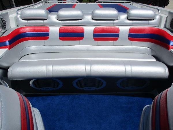 Slide: The Image of 1997 Formula 382 FASTech boat interior with red, blue, and silver seating. - 16
