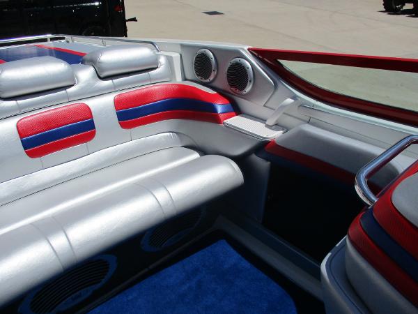 Slide: The Image of Interior of a 1997 Formula 382 FASTech boat with red, blue, and silver seating. - 17