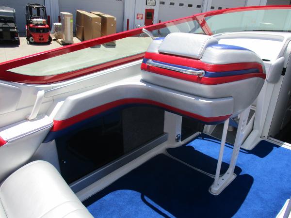 Slide: The Image of 1997 Formula 382 FASTech boat interior with red, white, and blue seating. - 18
