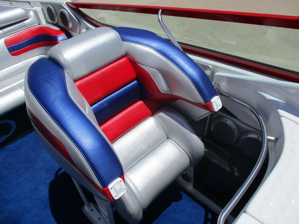 Slide: The Image of 1997 Formula 382 FASTech boat interior with red, blue, and silver seats. - 19