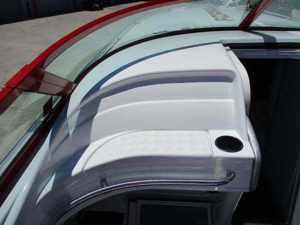 Slide: The Image of 1997 Formula 382 FASTech boat interior with red trim and cup holder. - 20