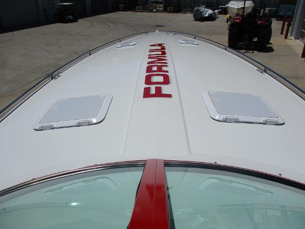 Slide: The Image of 1997 Formula 382 FASTech boat deck with red logo. - 21