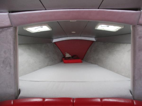 Slide: The Image of 1997 Formula 382 FASTech boat cabin interior with red and gray upholstery. - 24