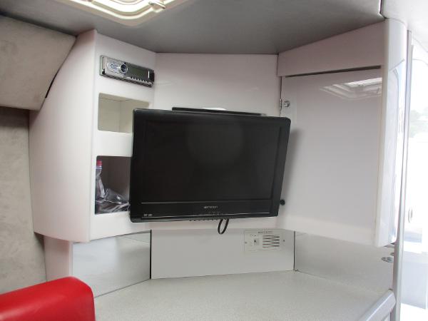 Slide: The Image of 1997 Formula 382 FASTech interior with mounted TV and storage compartments. - 25