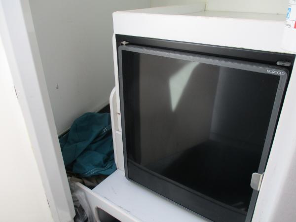 Slide: The Image of Small refrigerator inside a 1997 Formula 382 FASTech boat cabin. - 27