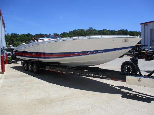 Slide: The Image of 1997 Formula 382 FASTech boat on Myco trailer in outdoor setting. - 3